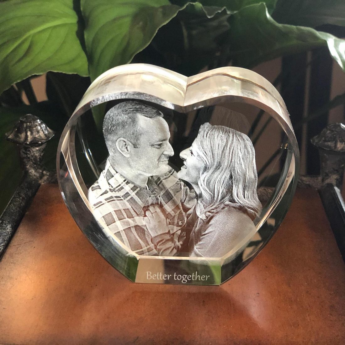 A wedding photograph, inside a solid crystal heart.